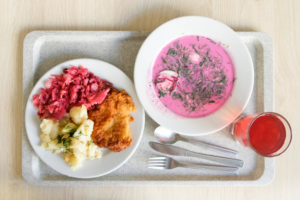 Lunch at Bar Bambino, a Polish milk bar: a glass of kompot, and pork schnitzel with red cabbage and buttered potatoes. 