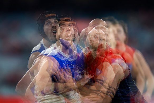 A blur: Tristan Xerri of the Kangaroos and Max Gawn of the Demons compete in a ruck contest.