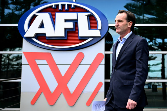 AFL CEO Andrew Dillon arrives to speak to media during a press conference in Melbourne.