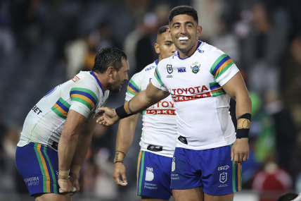 Emre Guler (right) celebrates the thrilling win with Raiders teammates.