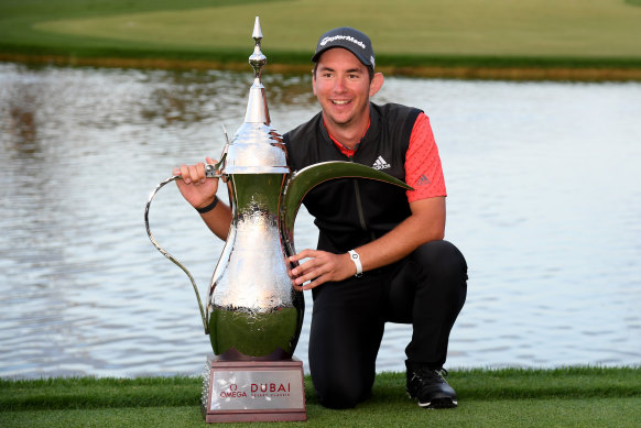 Lucas Herbert celebrates with his trophy.