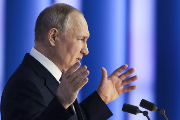 Russian President Vladimir Putin gestures as he speaks.
