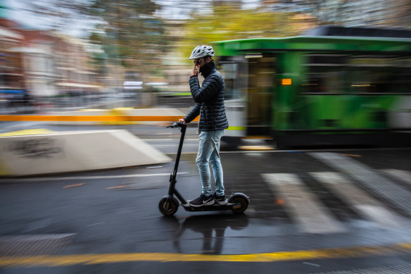 Declan riding his e-scooter to Melbourne University on Wednesday morning.