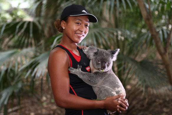 Tennis star Naomi Osaka holding a koala at Lone Pine in 2019.
