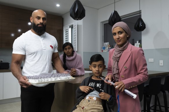Ismaeel Ahmad (centre front) and his father Usman (left), mother Javeria (right) and sister Rumaysa (back) at their Merrylands home.