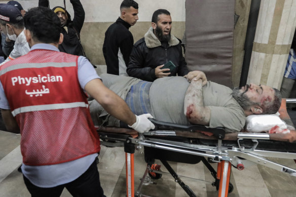 Palestinians injured in Israeli raids arrive at Nasser Medical Hospital in Khan Yunis, Gaza.