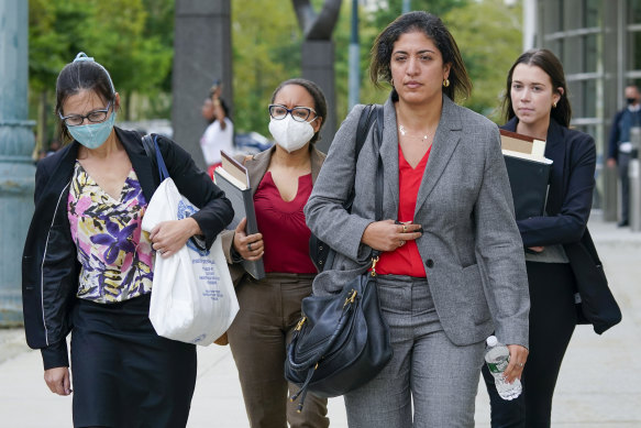 Assistant United States Attorneys Elizabeth Geddes, left, Maria Cruz Melendez, second from left, and Nadia Shihata, second from right leave Brooklyn Federal court at the end of the day in R&B star R. Kelly’s trial in New York. 