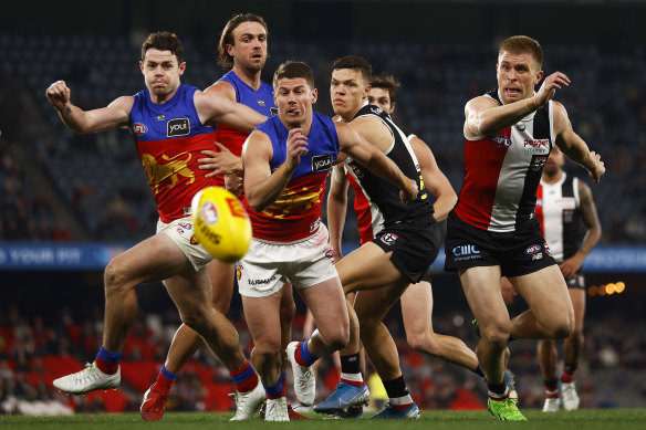 Dayne Zorko and Sebastian Ross vie for possession.