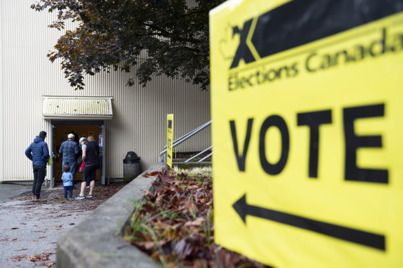 Voters arrive at a polling station in North Vancouver, British Columbia, Canada, on Monday.