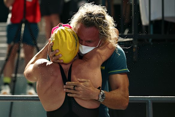 Lani Pallister is hugged by her coach Dean Boxall after brilliant 800m freestyle victory at Pan Pacs. 