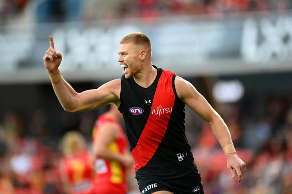 Peter Wright celebrates a goal for Essendon against his former club, Gold Coast.