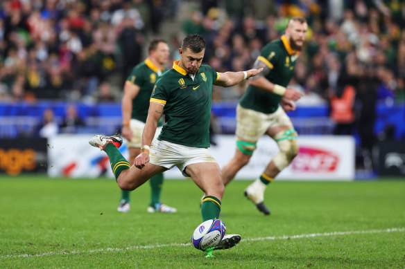 Handre Pollard of South Africa kicks the winning penalty goal.