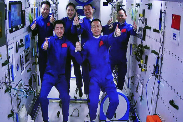 The Shenzhou-15 and Shenzhou-14 crew taking a group picture with their thumbs up after a historic gathering in space on Wednesday.