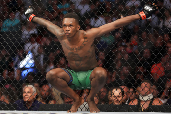 UFC star Israel Adesanya is ringside.