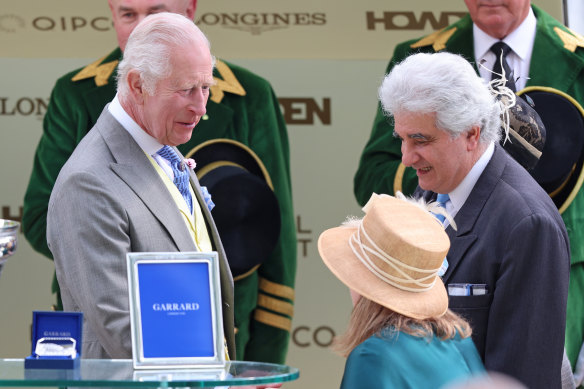 King Charles presents Melbourne taxi company owner Akram El-Fahkri with the King Charles III Stakes after his horse Asfoora recording a stunning victory.