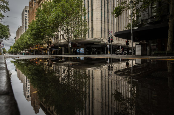 Swanston Street was wet - and empty - all weekend.