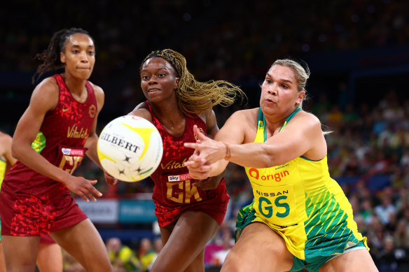 Funmi Fadoju of England and Donnell Wallam of Australia compete for the ball.