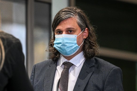Benjamin Aitken leaves court in 2022, when he was convicted of a raft of offences. He did not yet have his distinctive facial tattoo.