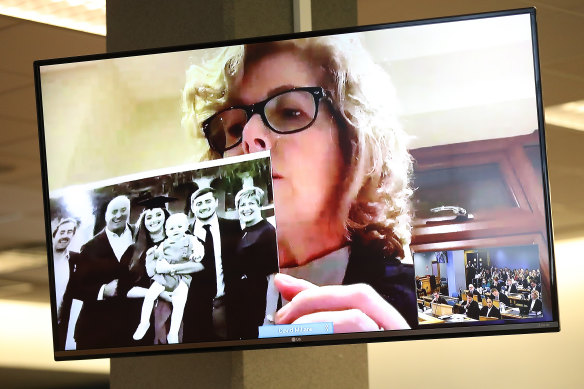 Grace's mother Gillian Millane holds a family photograph during her televised victim impact statement from her home in the UK in February. 