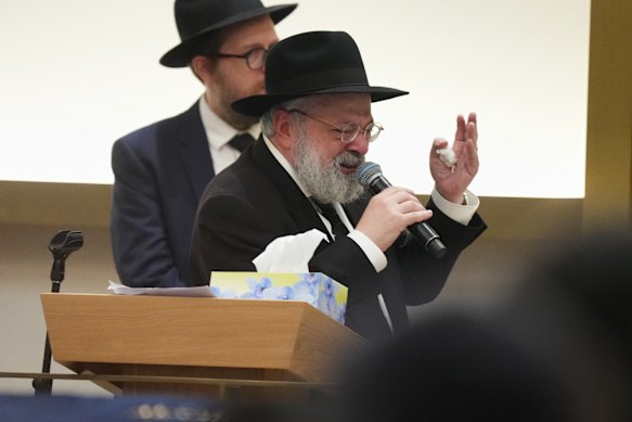 An emotional Rabbi Yehoram Ulman speaks at the funeral.
