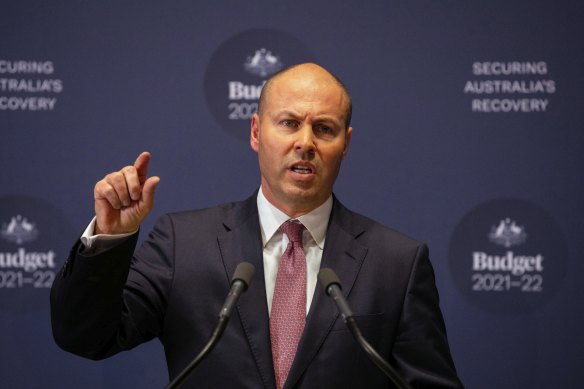 Treasurer Josh Frydenberg and Finance Minister Simon Birmingham during a budget lock up press conference at Parliament House in Canberra on May 11, 2021.