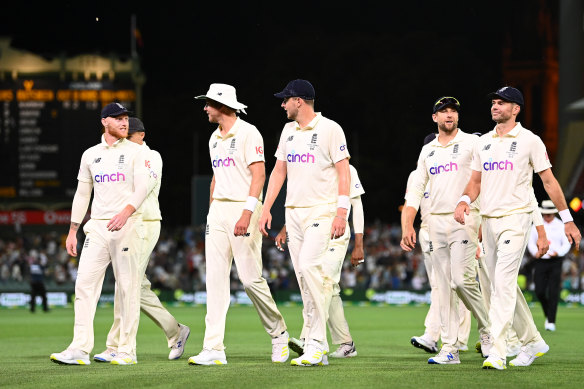 England players walk off the field after play on day three.