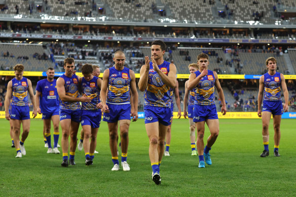 Liam Duggan leads the Eagles from the field after playing his 150th game.