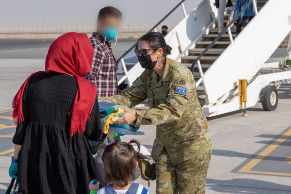 People leaving Afghanistan for Australia last month in the wake of the Taliban takeover.