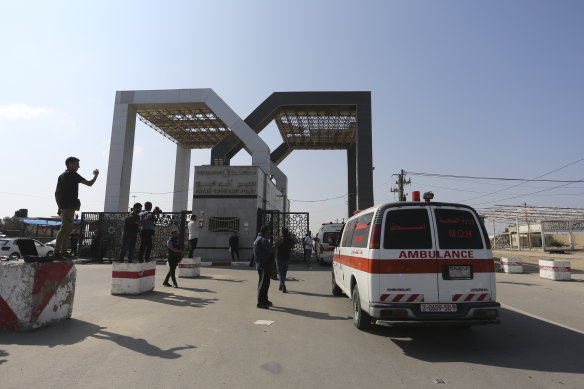 Palestinian ambulances arrive at the border crossing.