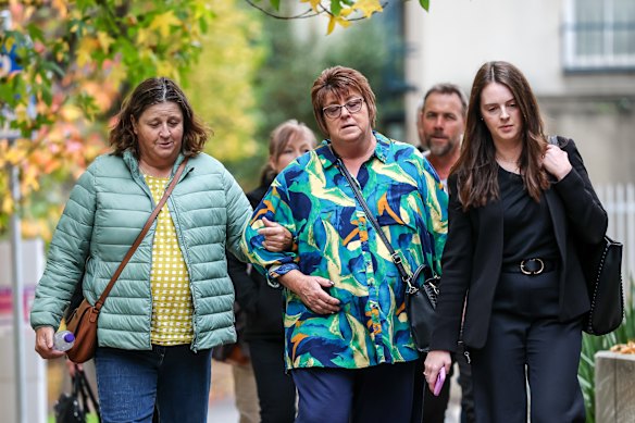 Neal Thompson’s sisters, Lois Kirk (left) and Dianne Thompson (centre), at the Coroners Court on Monday.