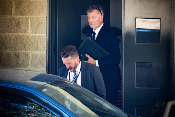 Detectives leave the Murphy house in Ballarat on Thursday.