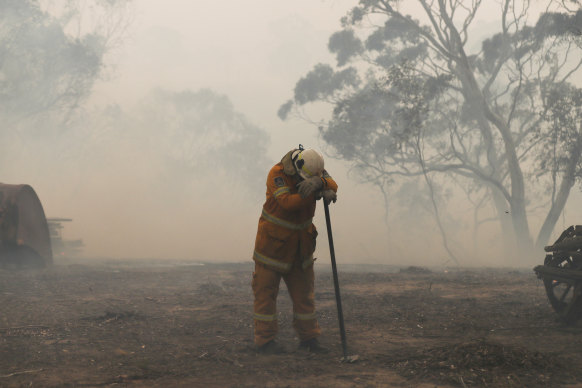 Alex Ellinghausen’s photograph of firefighter Chris Montgomery that has been granted a form of immortality by the NSW Rural Fire Service.