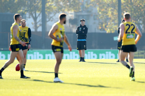 Damien Hardwick watches on as some of his players return to training on Monday.