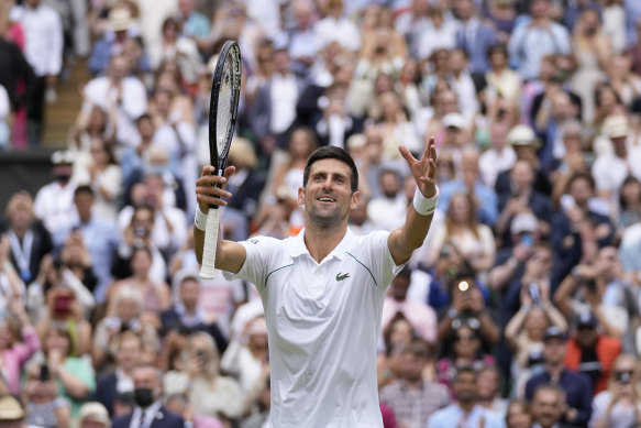 Sharing the love: Djokovic celebrates with the crowd after his Wimbledon win last year.