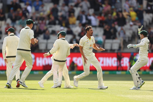 Mitchell Starc celebrates after dismissing England opener Zak Crawley