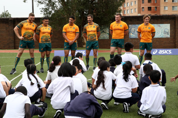Wallabies (from right) Lachie Swinton, Izaia Perese, Lalakai Foketi, Jake Gordon, Angus Bell and Michael Hooper at a jersey launch at St Johns Primary School, Auburn.