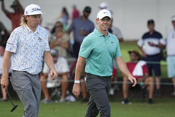 Cameron Smith and Rory McIlroy striding the fairways together.