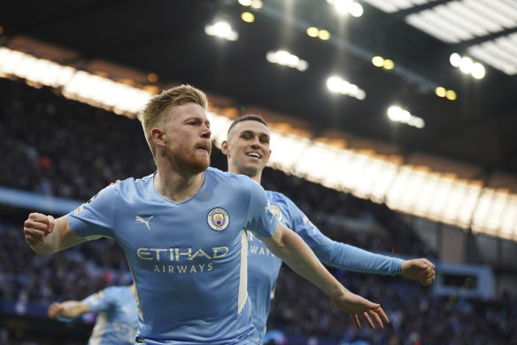 Kevin De Bruyne, front, celebrates with Phil Foden after opening the scoring for City inside two minutes.