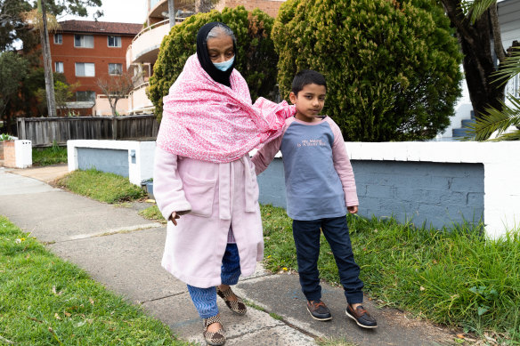 Maizen takes his grandmother for a walk around the block in Lakemba  during Sydney’s lockdown. 