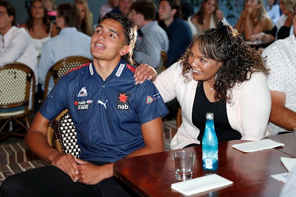 No.1 pick Jamarra Ugle-Hagan celebrates with family on draft night.
