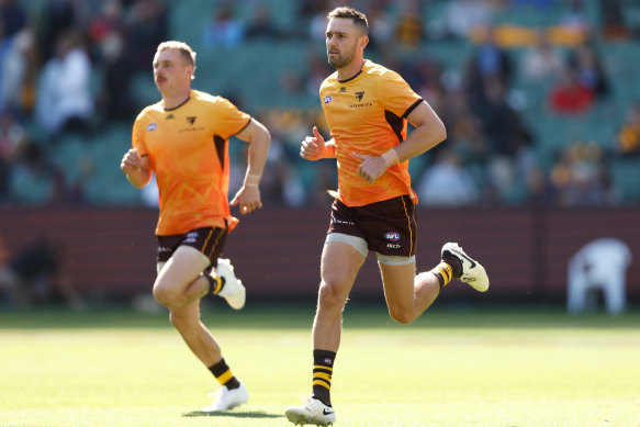 Jack Gunston (right) in the warm-up of what proved to be another quiet game for the Hawks.