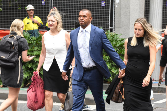 Kurtley Beale arrives at Downing Centre District Court with his barrister Margaret Cunneen, SC, (left) and wife Maddi Beale (right).