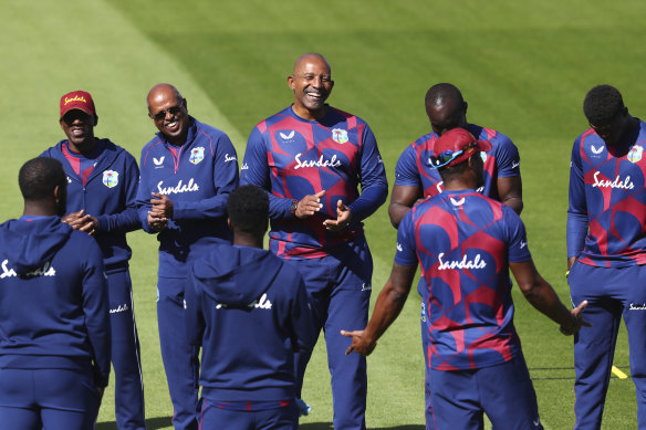 West Indies head coach Phil Simmons, centre, with his team. 
