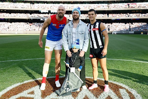 Captains Max Gawn and Nick Daicos with retired NRL player Jai Arrow, who tossed the coin for the Big Freeze game weeks after recently revealing he is fighting MND.