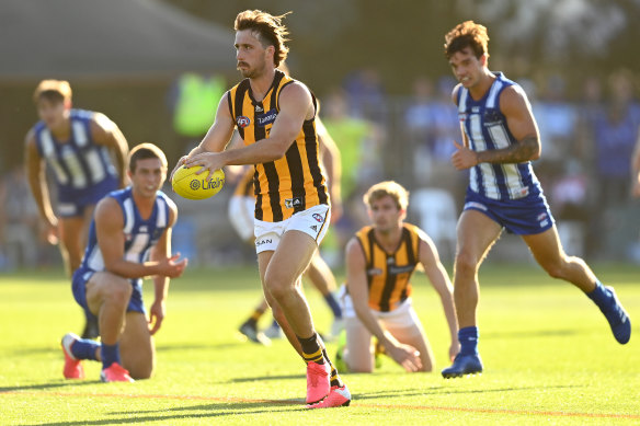 Tom Phillips gets a kick away for the Hawks on Saturday.