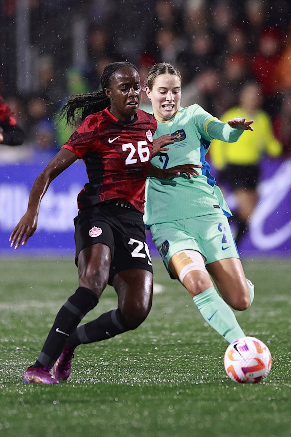 Simi Awujo and Courtney Nevin battle for the ball.