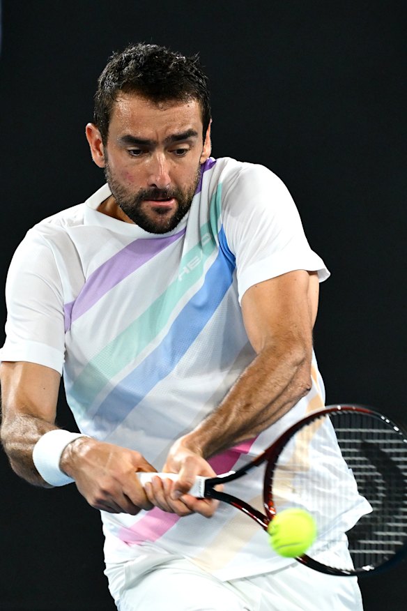 Marin Cilic of Croatia plays a backhand against Casper Ruud of Norway.