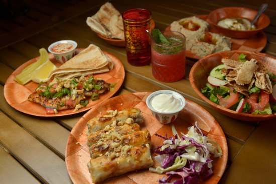 Spiced lamb cigars and chilli snapper with dips and salad.