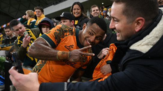 Filippo Daugunu smiles with fans after the Wallabies’ win.