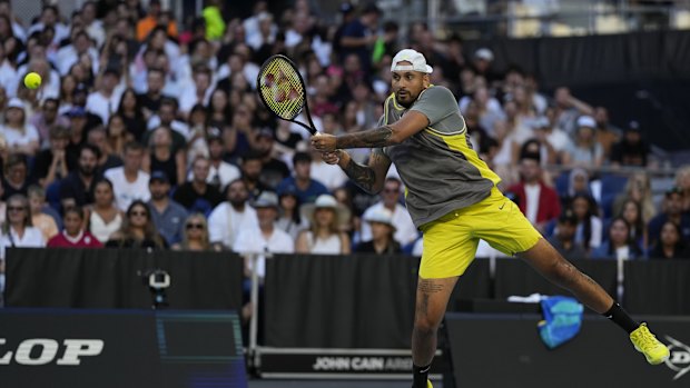 Nick Kyrgios of Australia plays a backhand return to Jacob Fearnley of Britain during their first round match at the Australian Open tennis championship in Melbourne, Australia, Monday, Jan. 13, 2025. (AP Photo/Ng Han Guan)